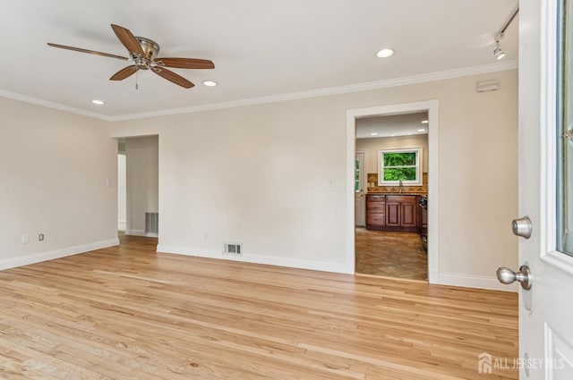 13 Spyros Dr, Old Bridge, NJ 08879 - empty room with light wood finished floors, ceiling fan, crown molding, and recessed lighting
