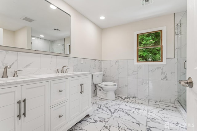 13 Spyros Dr, Old Bridge, NJ 08879 - full bath featuring marble look tiles, a marble finish shower, double vanity, recessed lighting, and tile walls