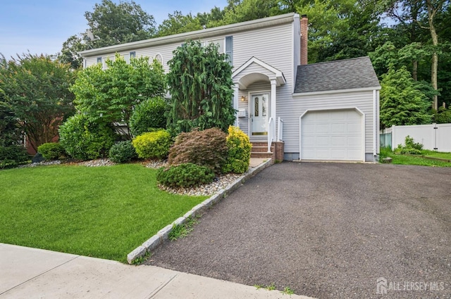 13 Spyros Dr, Old Bridge, NJ 08879 - view of front of house featuring an attached garage, driveway, a chimney, and a shingled roof