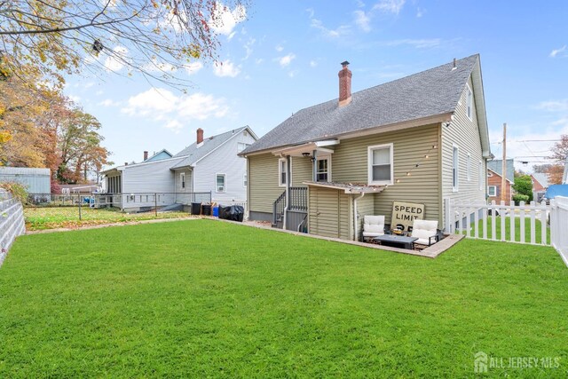 back of property with cooling unit and a lawn