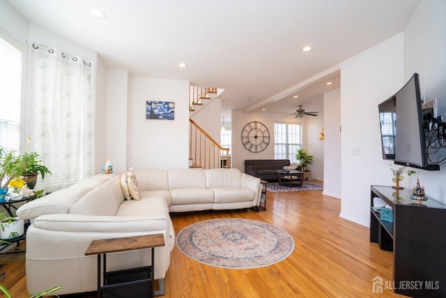 living room featuring a ceiling fan, stairway, recessed lighting, and wood finished floors