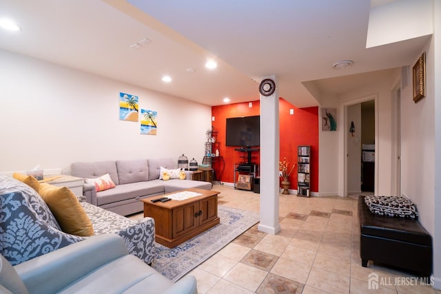 living room with recessed lighting, baseboards, and light tile patterned floors