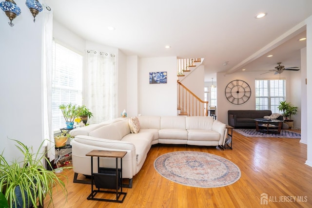 living area with recessed lighting, stairs, a ceiling fan, and wood finished floors