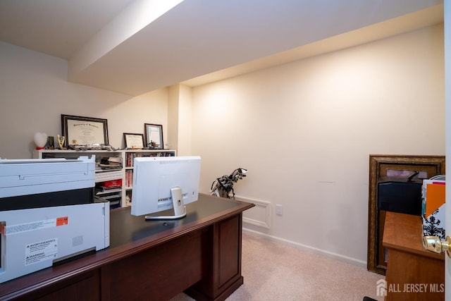 office area with light colored carpet and baseboards