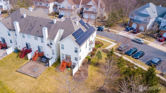 birds eye view of property with a residential view