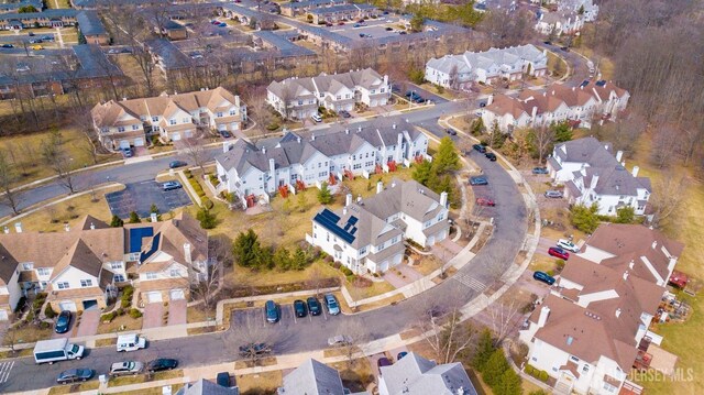 birds eye view of property with a residential view