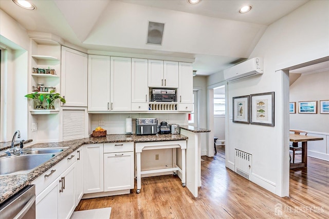 227 Lawrence Ave, Highland Park, NJ 08904 - kitchen with dishwasher, open shelves, vaulted ceiling, white cabinetry, and recessed lighting