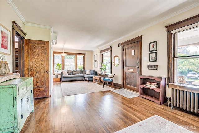 227 Lawrence Ave, Highland Park, NJ 08904 - living area featuring hardwood / wood-style floors and crown molding