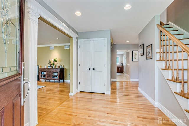8 Renee Ct, Edison, NJ 08820 - entrance foyer featuring light wood-style floors, stairs, baseboards, crown molding, and recessed lighting