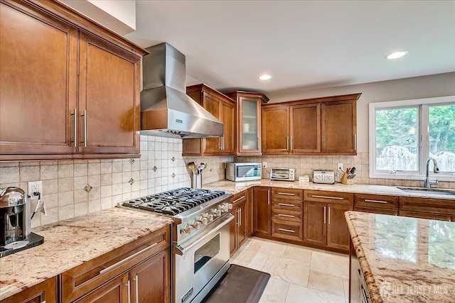 8 Renee Ct, Edison, NJ 08820 - kitchen featuring exhaust hood, stainless steel appliances, a sink, brown cabinets, and light stone counters