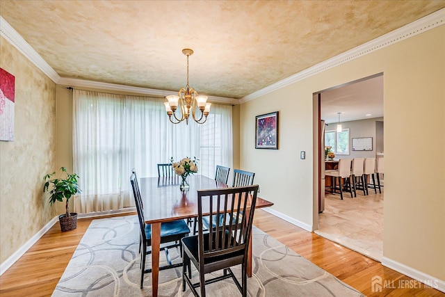 8 Renee Ct, Edison, NJ 08820 - dining space featuring wood finished floors, a chandelier, baseboards, and crown molding