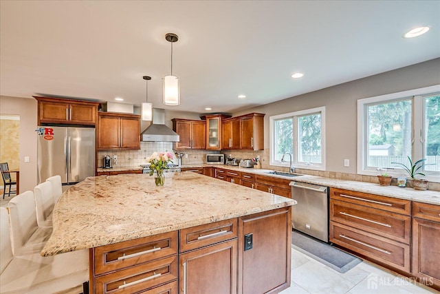 8 Renee Ct, Edison, NJ 08820 - kitchen featuring stainless steel appliances, wall chimney range hood, a sink, brown cabinetry, and recessed lighting