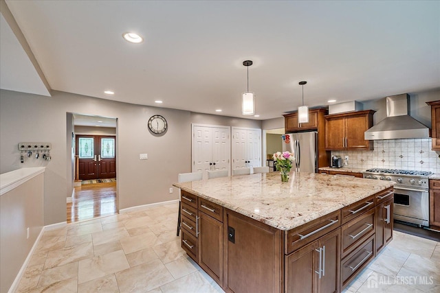 8 Renee Ct, Edison, NJ 08820 - kitchen featuring wall chimney exhaust hood, appliances with stainless steel finishes, recessed lighting, baseboards, and light stone countertops