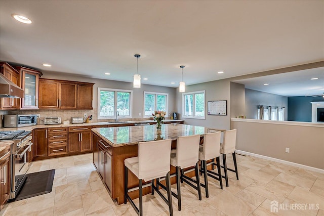 8 Renee Ct, Edison, NJ 08820 - kitchen featuring high end stainless steel range, a sink, plenty of natural light, a kitchen island, and recessed lighting