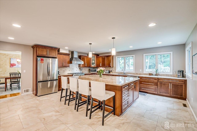 8 Renee Ct, Edison, NJ 08820 - kitchen featuring appliances with stainless steel finishes, wall chimney exhaust hood, a sink, brown cabinets, and recessed lighting