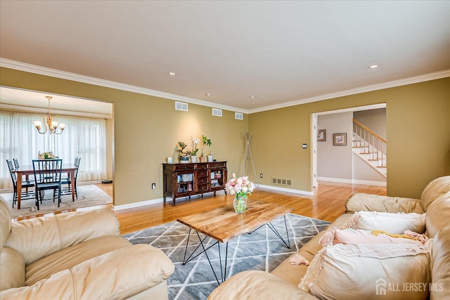 8 Renee Ct, Edison, NJ 08820 - living room with light wood finished floors, a chandelier, ornamental molding, baseboards, and stairs