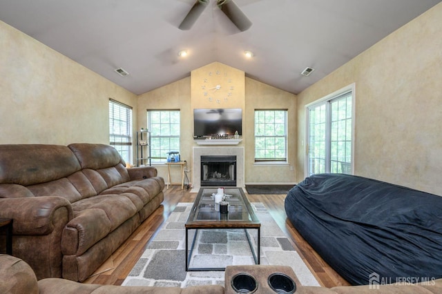 219 Vasser Dr, Piscataway, NJ 08854 - living area featuring wood finished floors, lofted ceiling, ceiling fan, and a fireplace