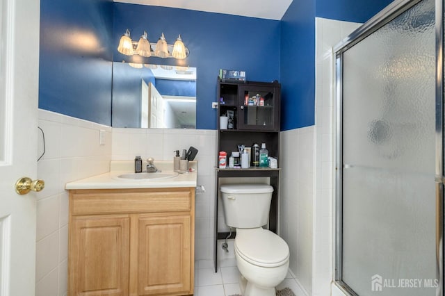 219 Vasser Dr, Piscataway, NJ 08854 - full bath featuring tile walls, vanity, toilet, a shower stall, and tile patterned flooring