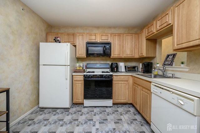 219 Vasser Dr, Piscataway, NJ 08854 - kitchen featuring white appliances, a sink, light countertops, light brown cabinets, and baseboards