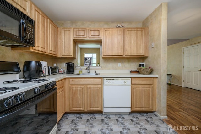 219 Vasser Dr, Piscataway, NJ 08854 - kitchen with gas range, black microwave, dishwasher, a sink, and light countertops
