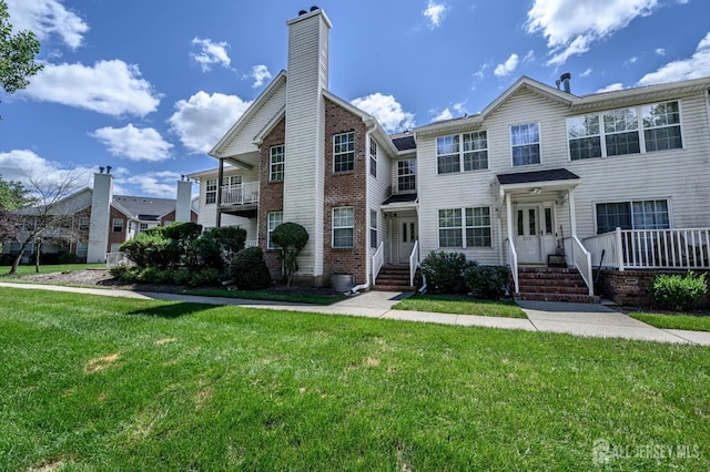 219 Vasser Dr, Piscataway, NJ 08854 - view of property featuring a front yard and brick siding