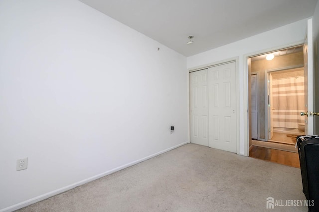 219 Vasser Dr, Piscataway, NJ 08854 - unfurnished bedroom featuring a closet, carpet, and baseboards