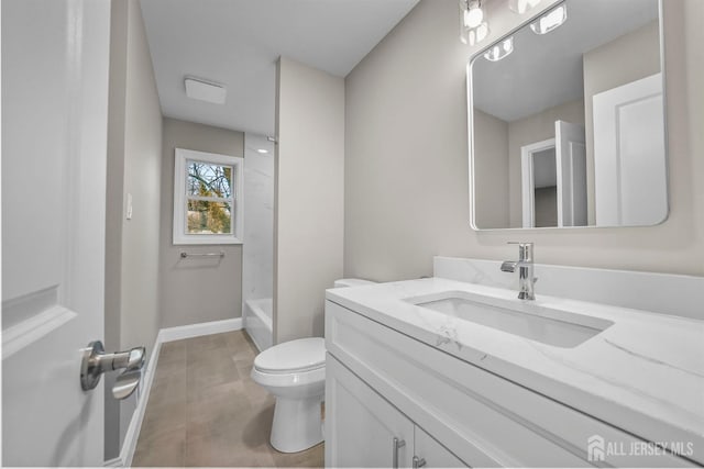 bathroom featuring bathtub / shower combination, baseboards, vanity, and toilet