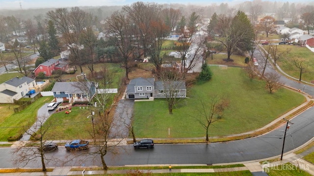 birds eye view of property with a residential view