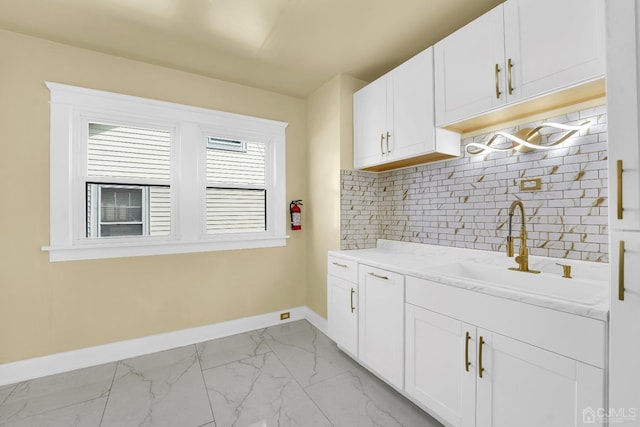 clothes washing area featuring sink