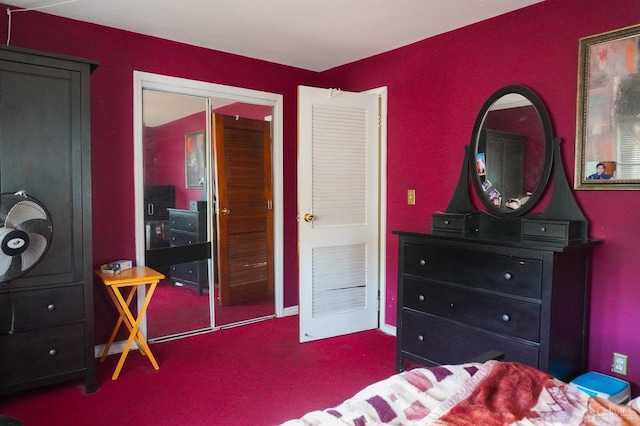 bedroom featuring carpet and a closet