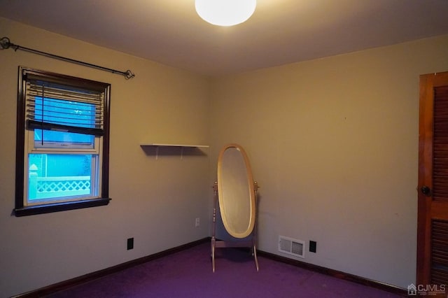 spare room with carpet floors