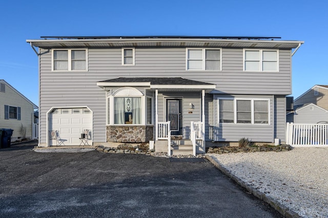 111 E Shrewsbury Dr E, Little Egg Harbor, NJ 08087 - view of front of home with a garage, a porch, and asphalt driveway
