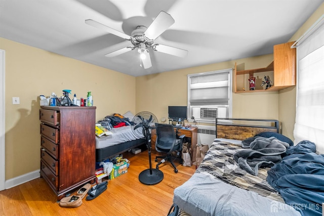 286 Easton Ave, New Brunswick, NJ 08901 - bedroom featuring cooling unit, wood finished floors, and a ceiling fan