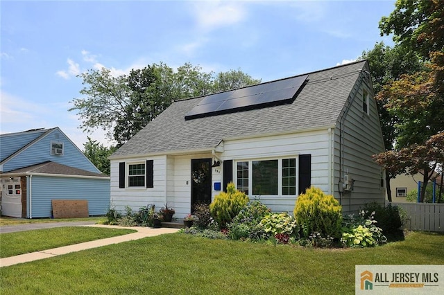 995 Old Bridge Tpke, East Brunswick, NJ 08816 - view of front of house featuring solar panels, a front lawn, and a shingled roof