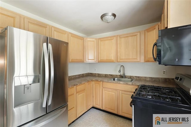 995 Old Bridge Tpke, East Brunswick, NJ 08816 - kitchen featuring stainless steel fridge, range with gas cooktop, light brown cabinets, and black microwave