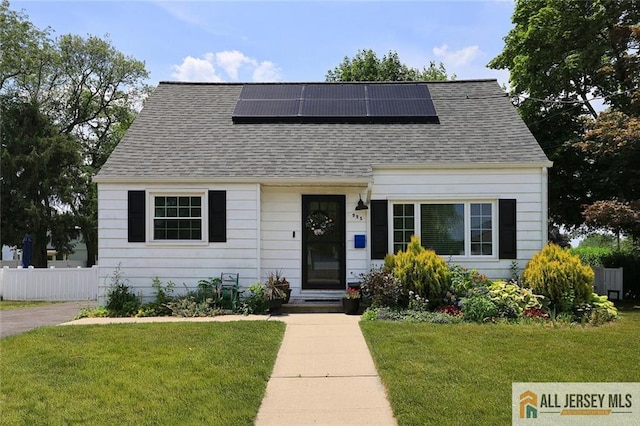 995 Old Bridge Tpke, East Brunswick, NJ 08816 - view of front of house featuring roof mounted solar panels and roof with shingles
