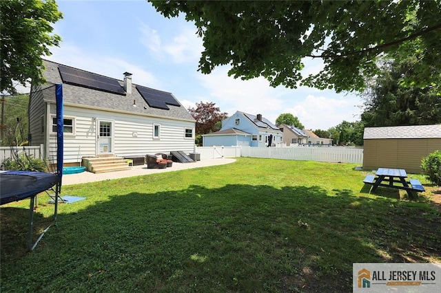 995 Old Bridge Tpke, East Brunswick, NJ 08816 - fenced backyard with a trampoline and an outdoor structure