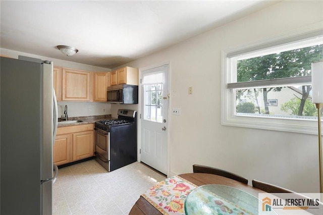 995 Old Bridge Tpke, East Brunswick, NJ 08816 - kitchen featuring stainless steel appliances, light brown cabinetry, and healthy amount of natural light