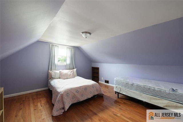 995 Old Bridge Tpke, East Brunswick, NJ 08816 - bedroom with wood finished floors and lofted ceiling