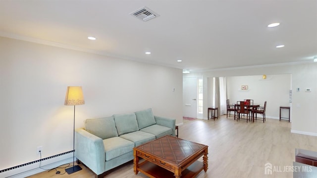 living room with visible vents, light wood-style flooring, a baseboard heating unit, recessed lighting, and crown molding