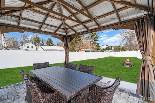 view of patio with a gazebo and a fire pit