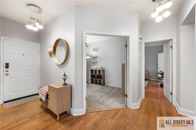 4301 Bayberry Ct, Middlesex, NJ 08852 - entrance foyer with a chandelier and light wood-style floors