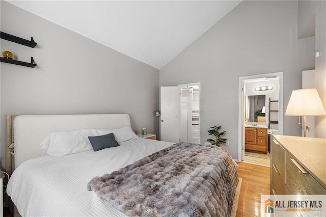 4301 Bayberry Ct, Middlesex, NJ 08852 - bedroom featuring high vaulted ceiling, light wood-style flooring, and ensuite bath