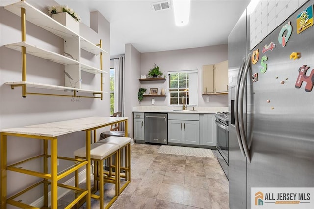 4301 Bayberry Ct, Middlesex, NJ 08852 - kitchen with stainless steel appliances, open shelves, gray cabinets, and light countertops