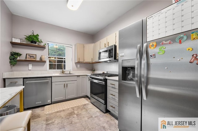 4301 Bayberry Ct, Middlesex, NJ 08852 - kitchen featuring appliances with stainless steel finishes, gray cabinets, open shelves, and light stone counters