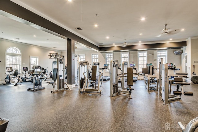 exercise room with ornamental molding, recessed lighting, visible vents, and plenty of natural light