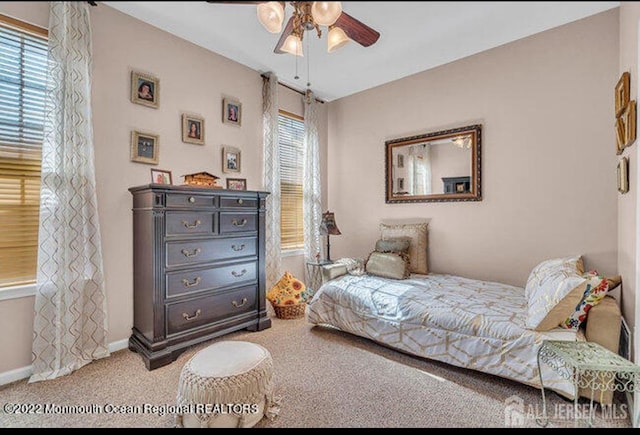 bedroom featuring carpet flooring, a ceiling fan, and baseboards