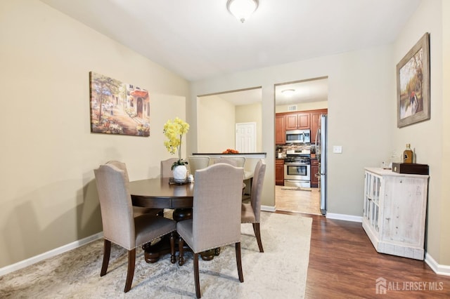 179 Sunshine Dr, Piscataway, NJ 08854 - dining area featuring wood finished floors and baseboards