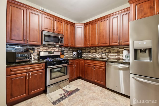 179 Sunshine Dr, Piscataway, NJ 08854 - kitchen featuring appliances with stainless steel finishes, backsplash, and dark stone countertops