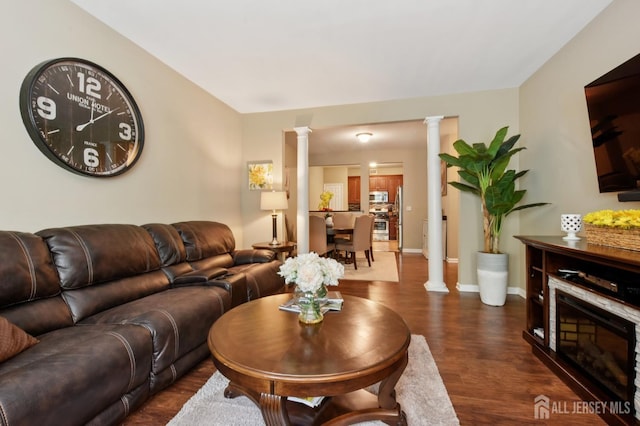 179 Sunshine Dr, Piscataway, NJ 08854 - living room featuring decorative columns and dark wood-style flooring